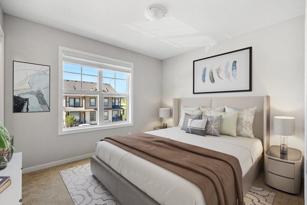 a bedroom with a large bed and a window