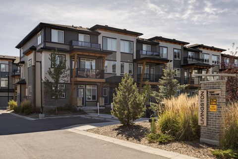 Apartment complex named Livingston with a yellow sign.