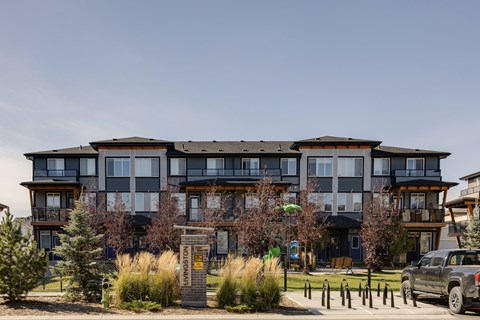 A large apartment building with a sign that says "Welcome to Whistler".