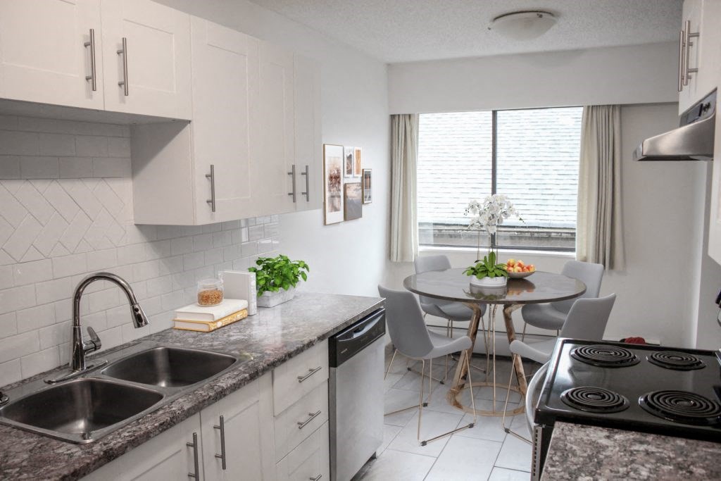 a kitchen and dining area in a 555 waverly unit