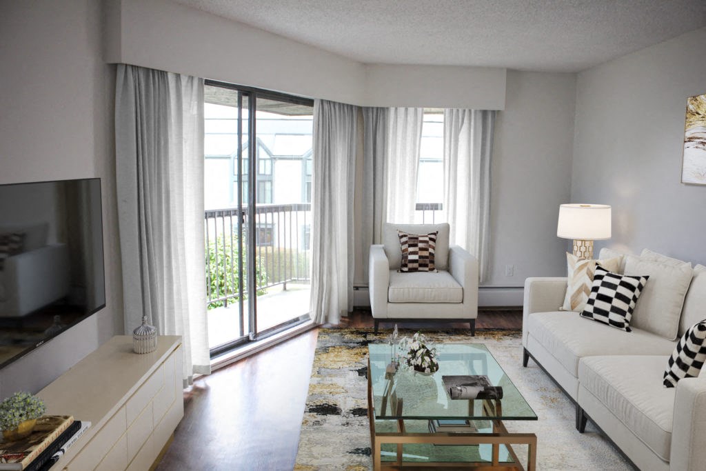 a living room with white furniture and a glass coffee table