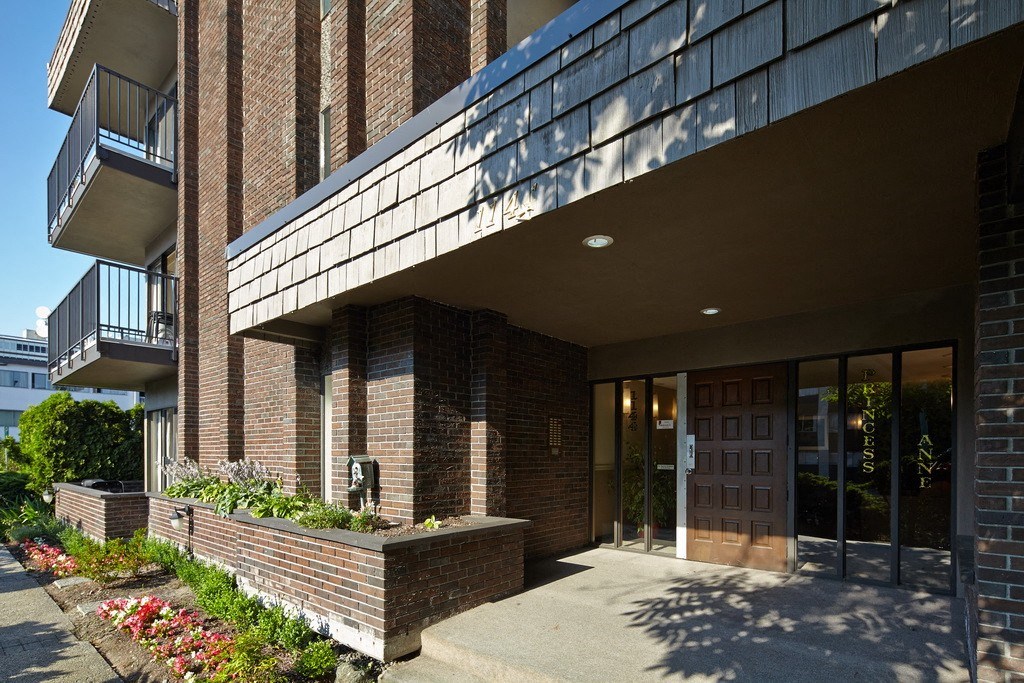 a large brick building with glass windows and doors
