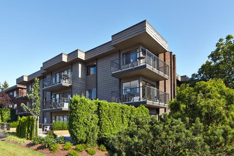 a picture of a building with a blue sky in the background