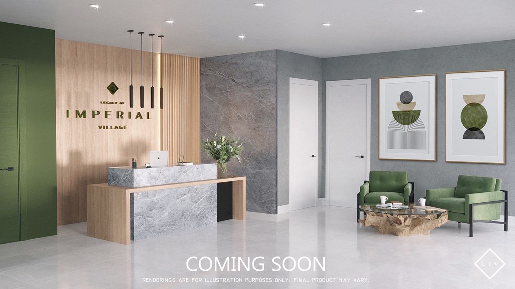 A modern lobby with a green chair and a reception desk.