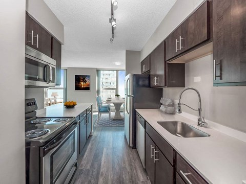 a kitchen with stainless steel appliances and a sink