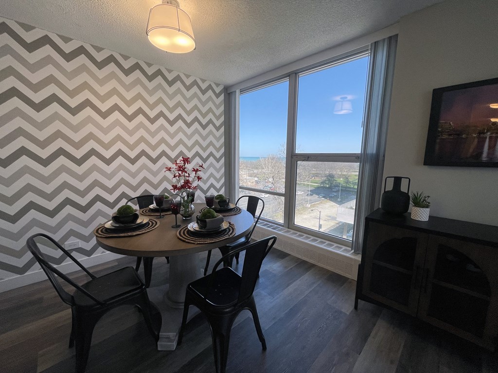 an aerial view of a dining room with a table and chairs and a window