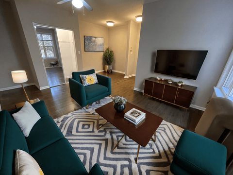 a living room with couches and a coffee table