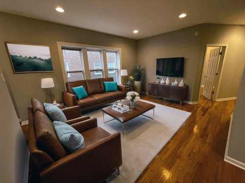 a living room with couches and a coffee table