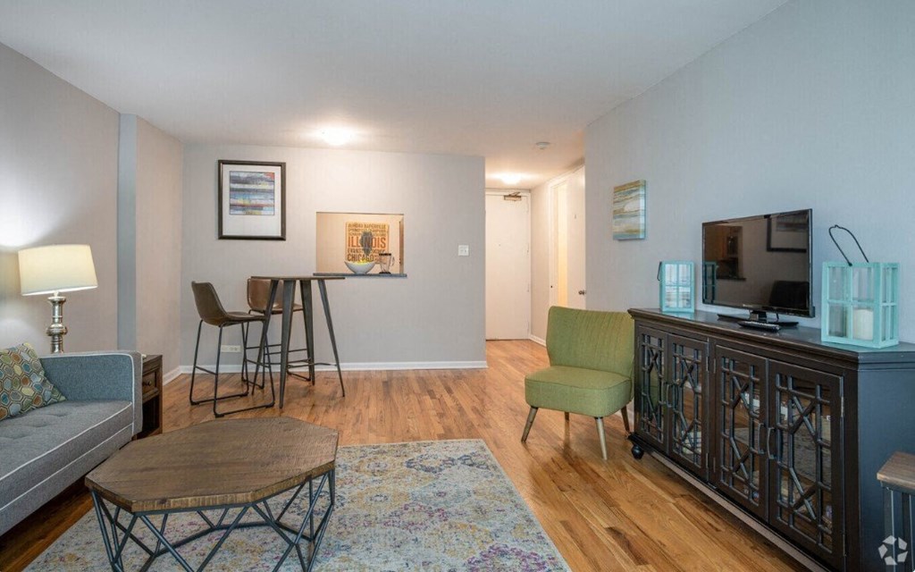 a living room with a couch and a table and a television