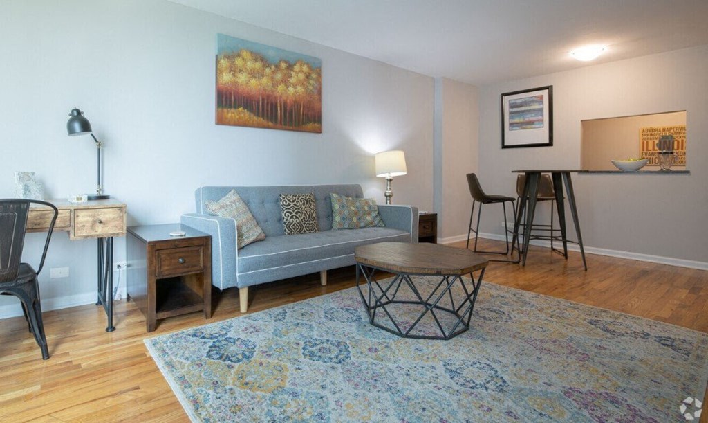 a living room with a couch and a table