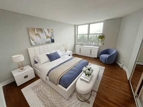 a bedroom with a bed and a chair and a window