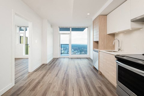 A kitchen with a stove top oven and a counter top.