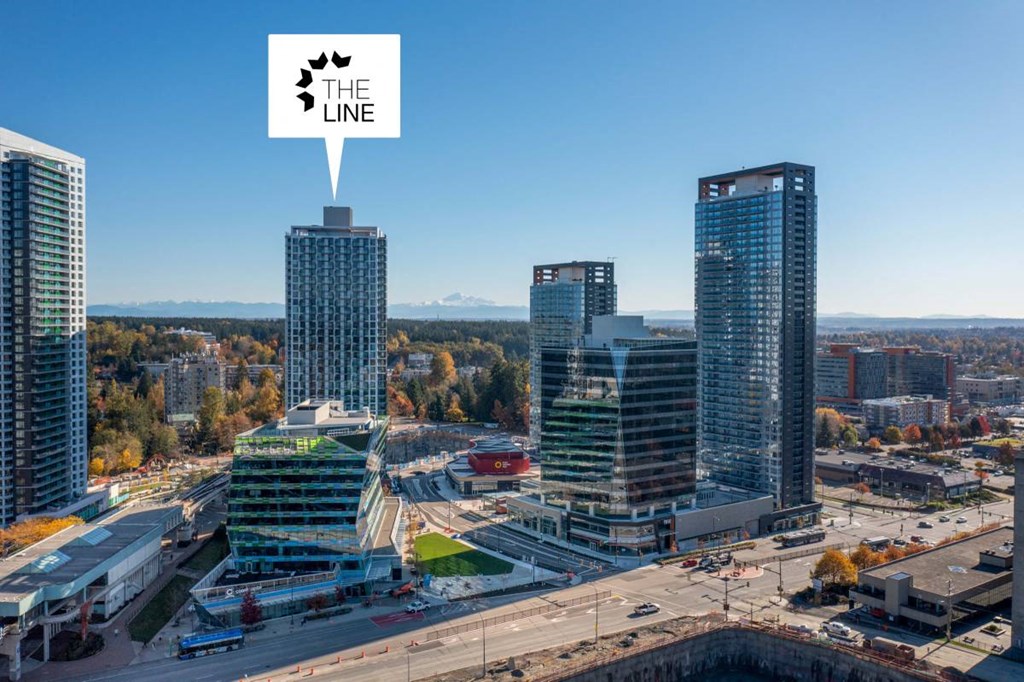 a city with tall buildings and a sign that reads the line