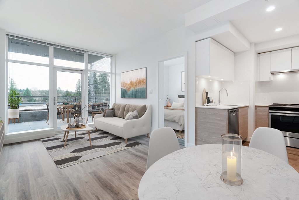 a living room and dining room with a couch and a table