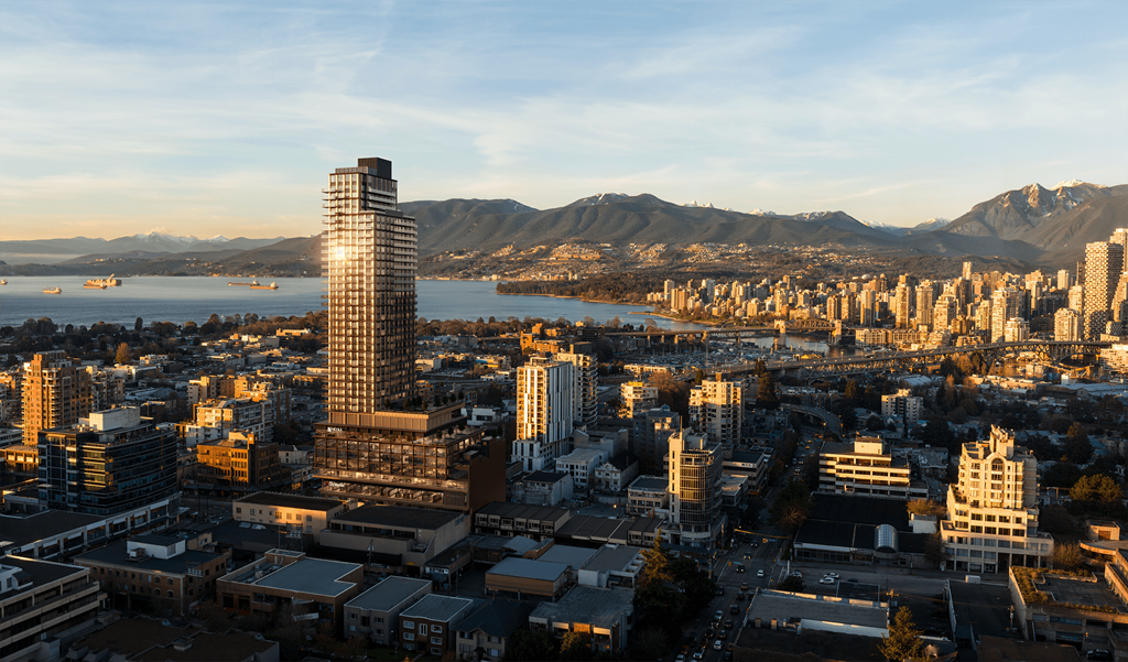 A cityscape with a prominent skyscraper in the foreground and a body of water in the background.
