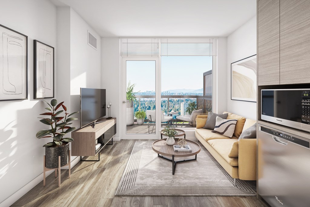 a living room with a couch and a tv and a balcony