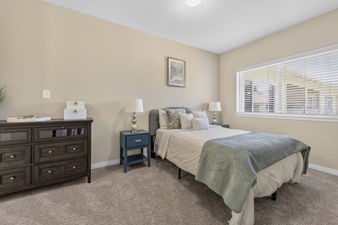 Bedroom with neutral decor and natural light at Vancouver Pointe Apartments, Washington, 98661