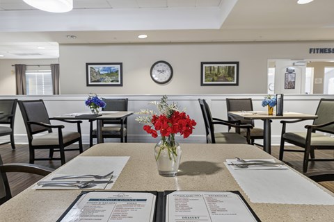 Community dining room with casual seating at Vancouver Pointe Apartments, Washington