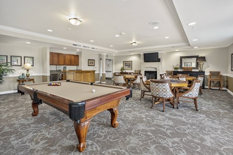 Recreation room with billiards and game tables at Lakeview Senior Living Apartments, Lakewood, Colorado