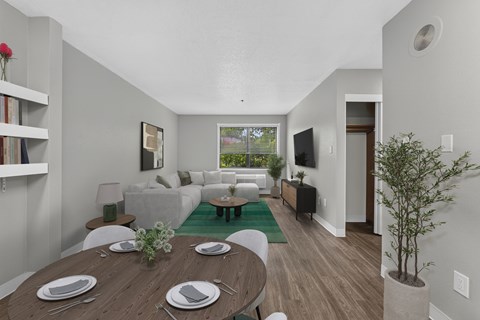 Open concept living and dining area with vaulted ceiling at King City Senior Village Apartments, Oregon