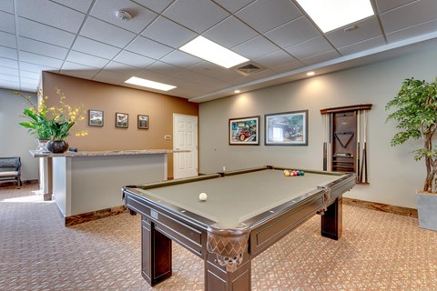 Recreation room with pool table and cue rack at Mountain Lakes Estates Apartments, Nevada