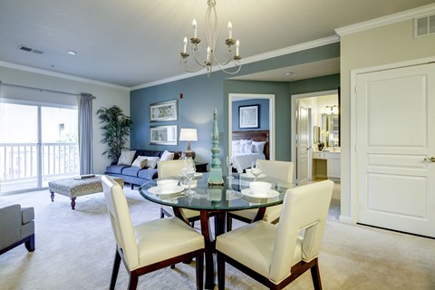 Open concept dining and living room with blue accent wall at Regency Crest Apartments, Ellicott City, 21043
