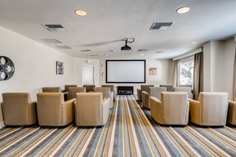 Theater room with projection screen and lounge seating at Vancouver Pointe Apartments, Vancouver