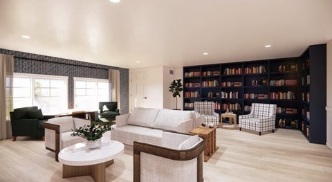 A living room with a white sofa, a coffee table, and a bookshelf filled with books.