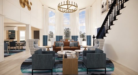 A modern living room with a staircase and a large window.