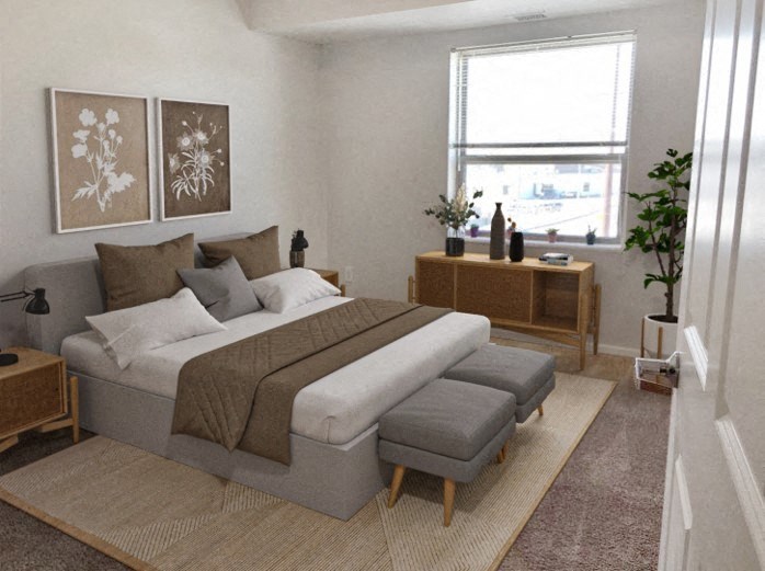 a bedroom with a bed and a window