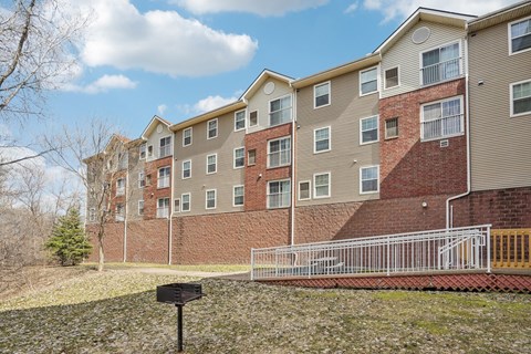 Apartment building with a mailbox in front.