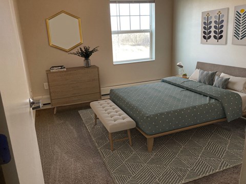 a bedroom with a bed and a dresser and a window