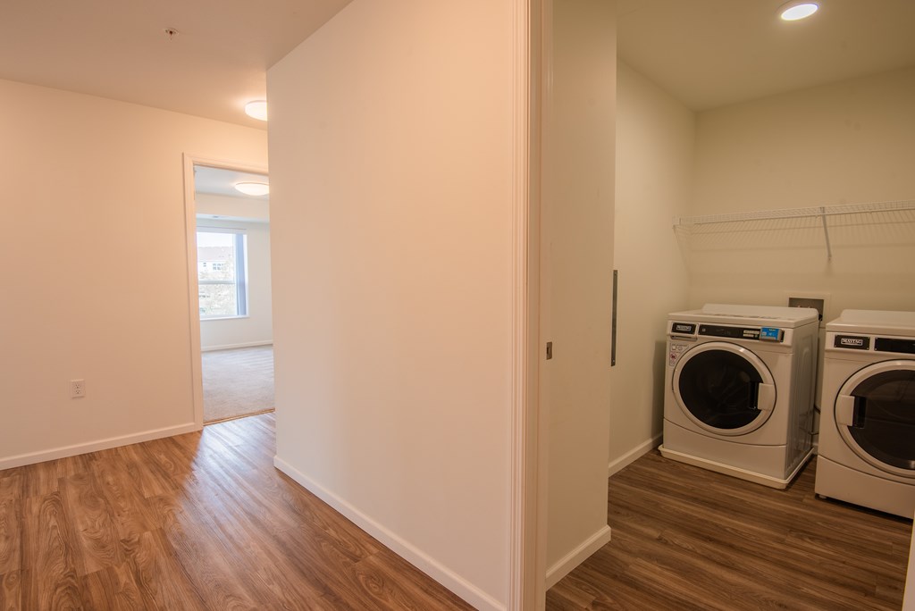 A laundry room with a washer and dryer.