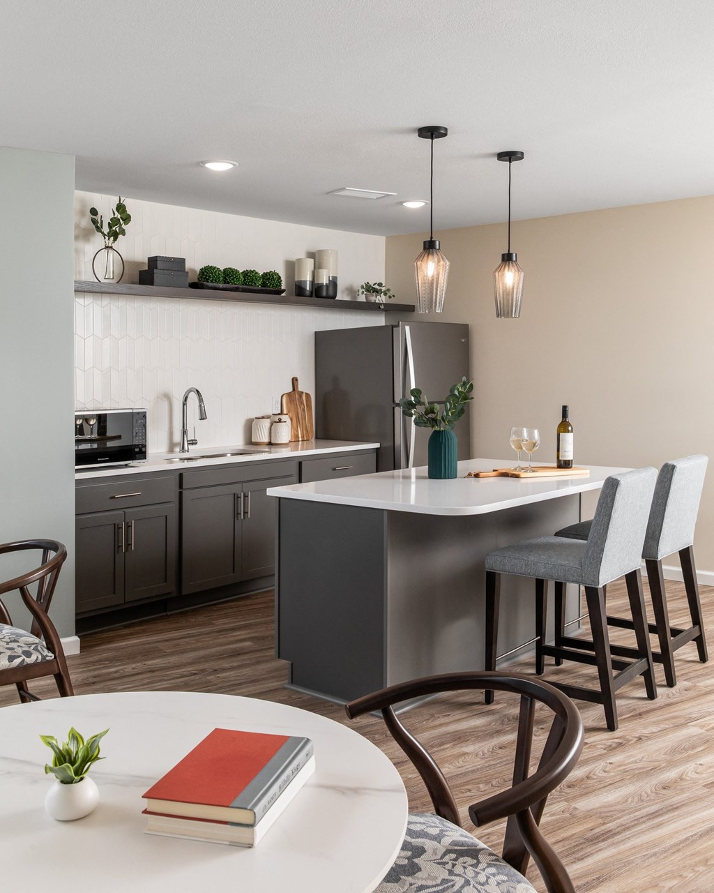 an open kitchen and dining area with a table and chairs
