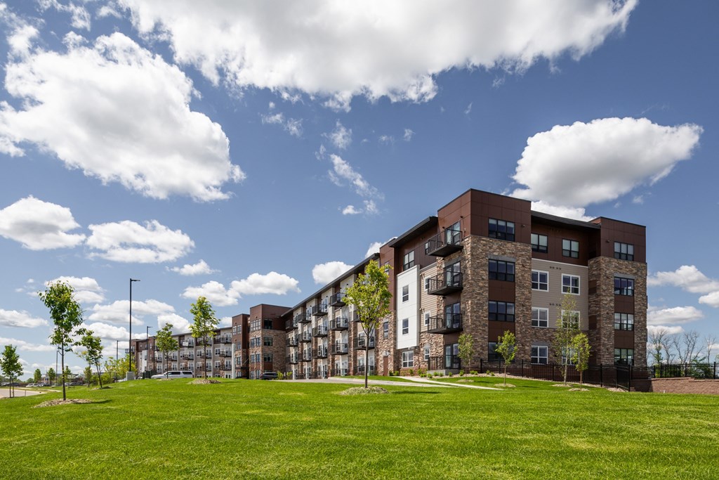 a large building with green grass in front of it