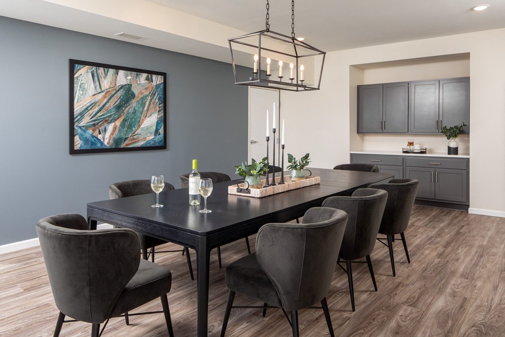 an image of a dining room with a table and chairs