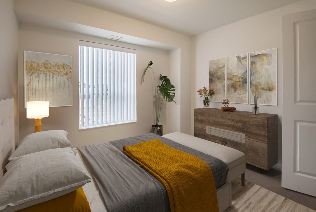 a bedroom with a bed and a dresser and a window