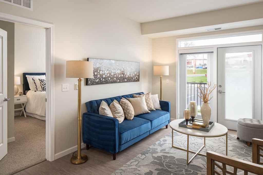 a living room with a blue couch