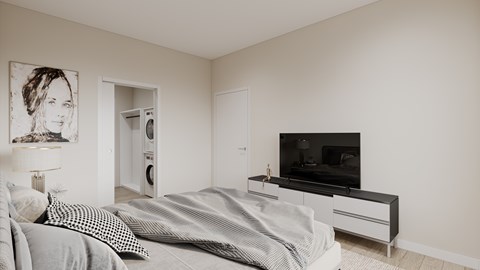 A bedroom with a bed, a television, and a painting on the wall.
