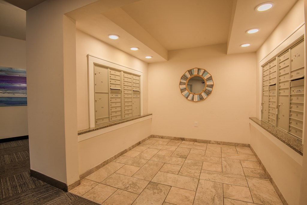 a locker room with a clock on the wall and a large window