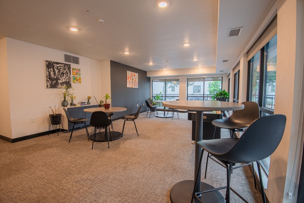 A room with a table and chairs in it.