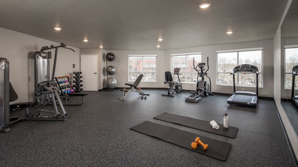 A spacious home gym with a variety of exercise equipment.