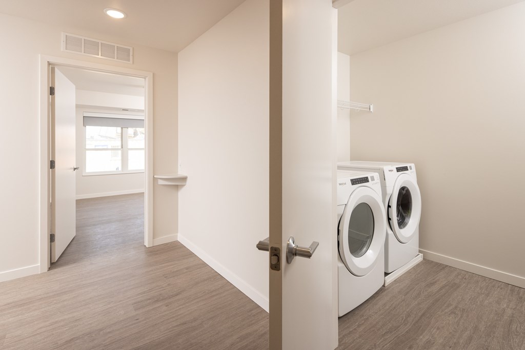A laundry room with a washer and dryer.