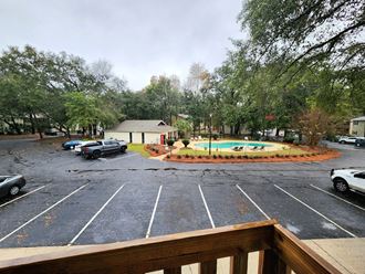 a view of a parking lot with a swimming pool