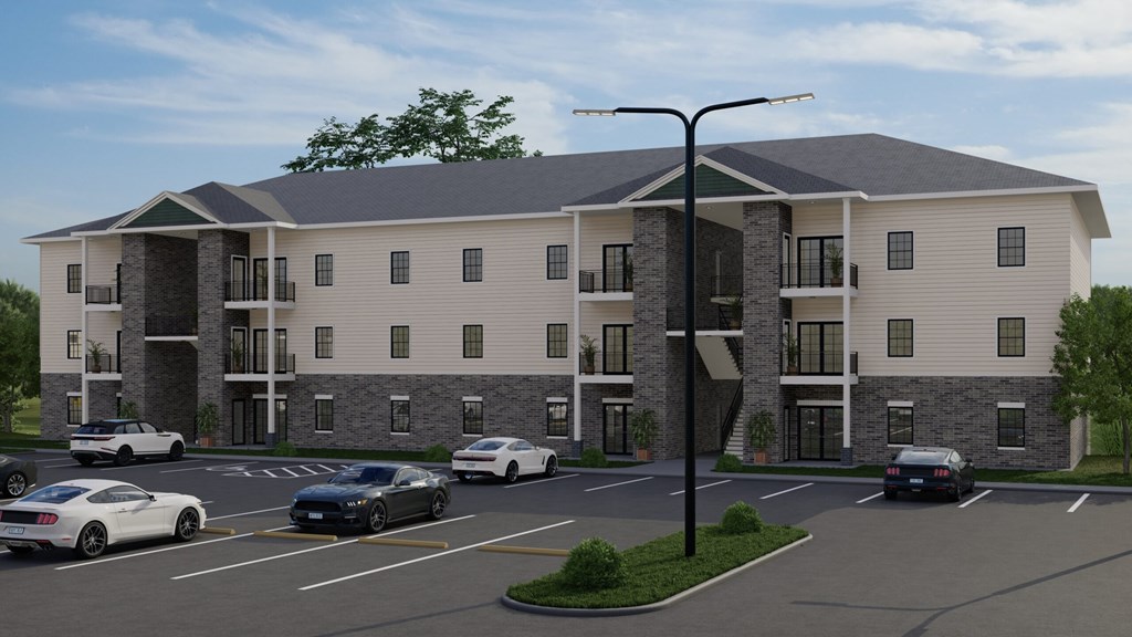 A rendering of a modern apartment complex with cars parked in the driveway.