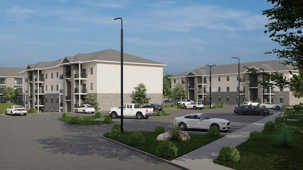 A rendering of a modern apartment complex with cars parked in the driveway.