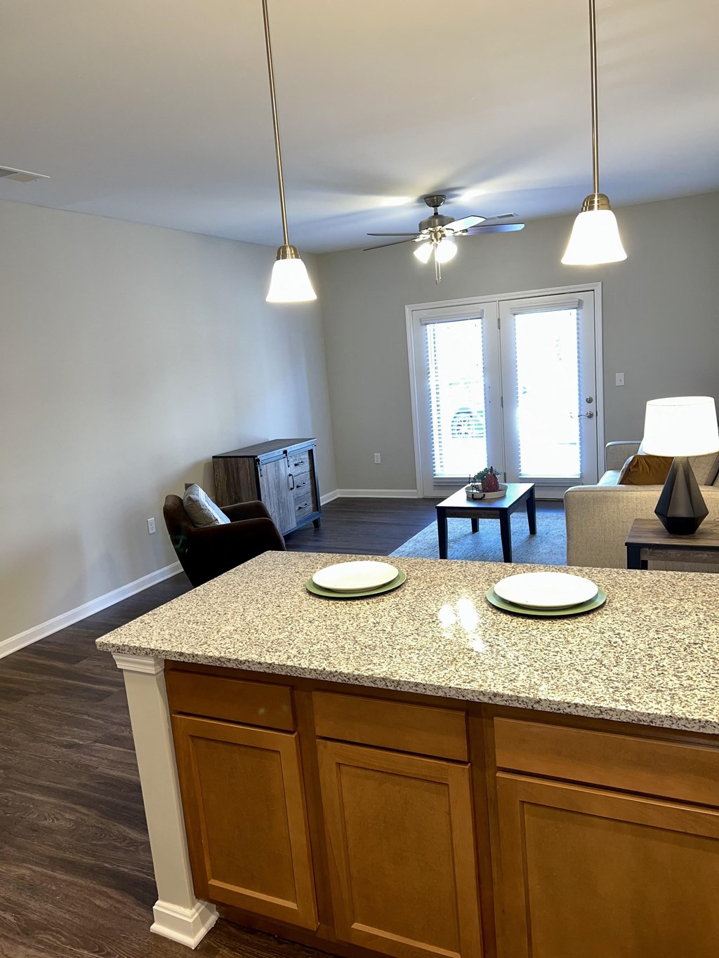 a view of living room from the kitchen, featuring the island