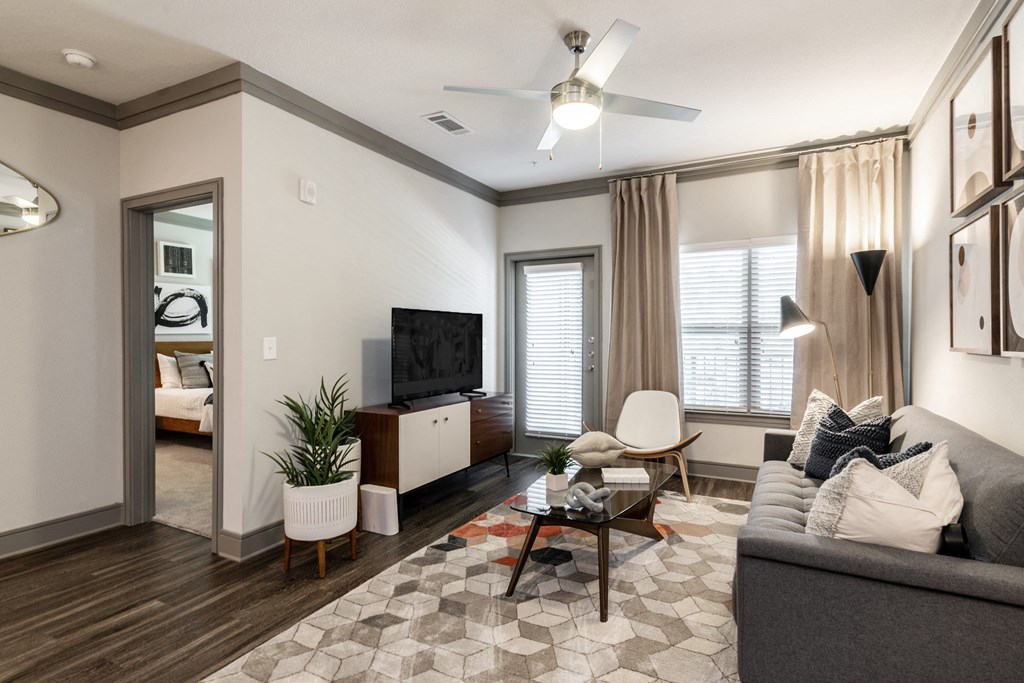 a living room with a couch and a tv