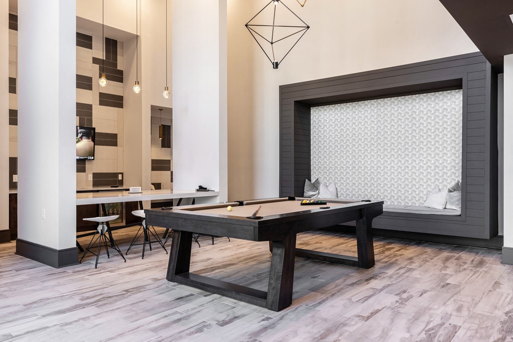 a games room with a pool table and a fireplace