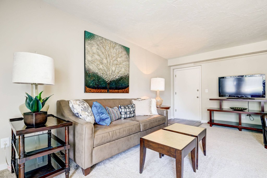 a living room with a couch and a tv